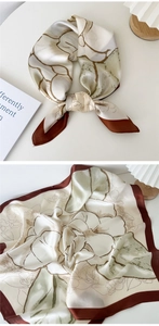 Detail of silk square scarf featuring vintage floral print and brown contrast border