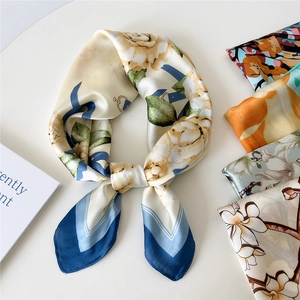 Floral square silk scarf with yellow flowers and blue geometric lines on beige background