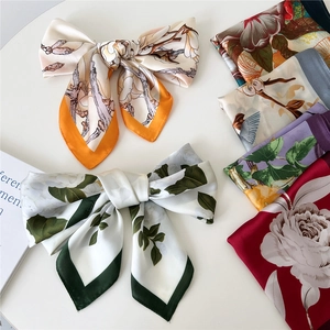 Silk-textured floral square scarf with elegant botanical patterns and rich colors