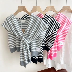 Striped knit shawl for women over white shirt in grey, black, and pink colors