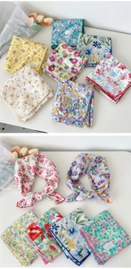 Detail of 100% cotton floral printed neck scarf with premium hemmed edges and floral patterns