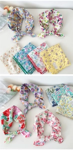 Flat lay of colorful floral cotton neckerchiefs with close-up on soft fabric texture