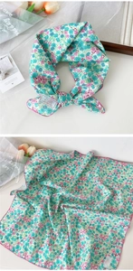 Detail of floral cotton neck scarf in mint green and pink, 100% cotton material texture