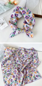 Detail of floral cotton square scarf with purple print and 100% cotton label