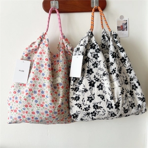 Floral drawstring tote bag with woven handles and crinkle texture fabric for women