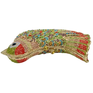 Macro view of colorful fish-shaped clutch with intricate handmade crystal scale details