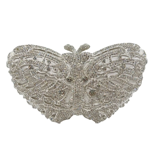 Macro shot of silver butterfly clutch bag with dense rhinestones and antenna metal clasp