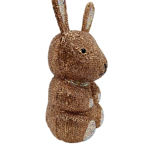 Close-up of brown crystal rhinestones and metal details on the rabbit evening clutch