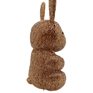 Macro detail of sitting rabbit evening bag fully encrusted with champagne crystal rhinestones