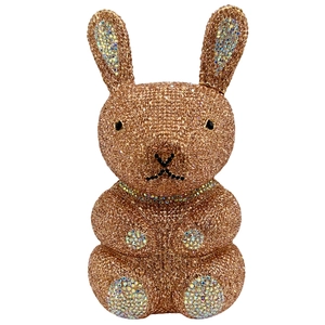 Macro detail of hand-set rose gold and colorful rhinestones on rabbit shaped clutch bag