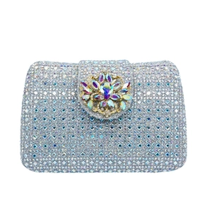 Detail of crystal clutch bag with colorful gemstone flower and silver rhinestones
