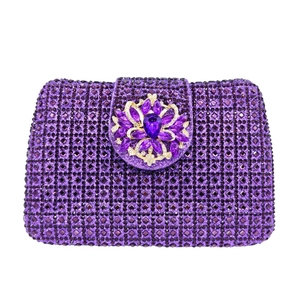 Macro detail of purple rhinestone evening clutch bag with large flower gemstone buckle