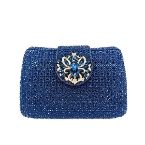 Detailed macro view of navy blue rhinestone evening clutch with teardrop gemstone