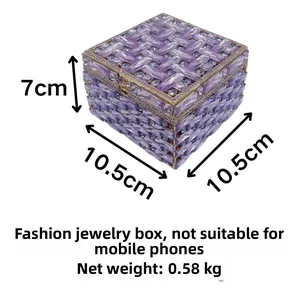 Macro view of purple crystal jewelry box with 10.5x10.5x7cm dimensions and rhinestones