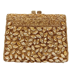 Close-up of golden clutch bag with marquise crystals and sparkling rhinestone details