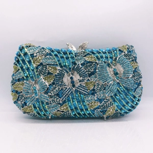 Exquisite butterfly evening clutch featuring blue and yellow crystals with metal clasp