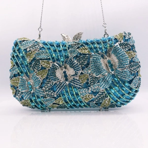 Detail of blue and yellow crystal encrusted butterfly evening clutch with silver chain