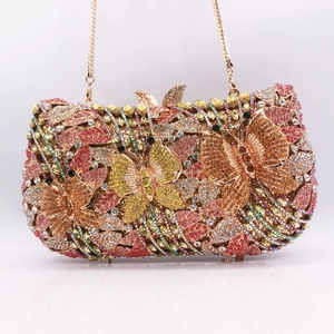 Macro detail of luxury hollow metal butterfly clutch with colorful crystal rhinestones