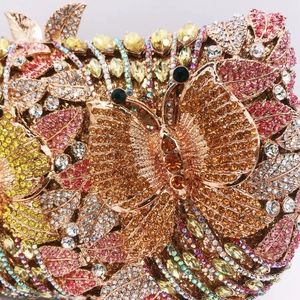 Detail of luxury evening clutch with butterfly pattern and colorful sparkling crystals