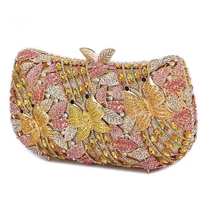 Macro detail of luxury evening clutch bag featuring colorful floral and butterfly crystal pattern