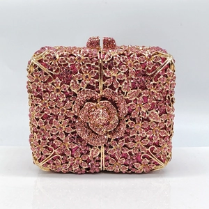 Elegant floral evening clutch bag with pink crystals and a 3D rose gold frame detail
