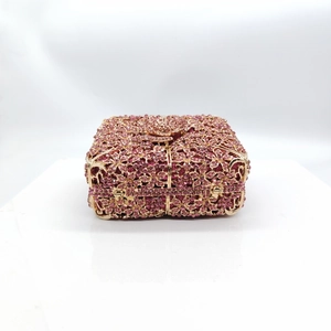 Exquisite hollow out flower evening bag with pink crystals and gold metallic frame