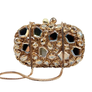 Luxurious gold evening clutch bag with amber rhinestones and metal snake chain strap