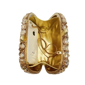 Luxury rhinestone evening clutch bag with gold chain strap, shown fitting a mobile phone