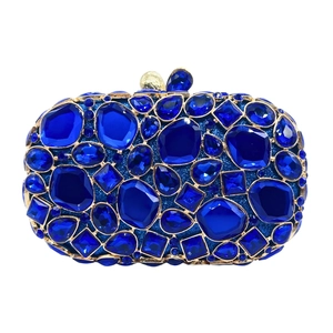 Macro shot of dark blue crystal rhinestones on luxury oval evening clutch bag