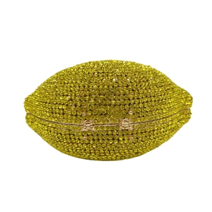 Detailed view of the rhinestone football-shaped evening clutch and metal closure