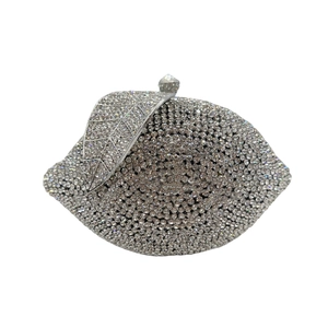 Detail of lemon crystal evening bag showing leaf metal clasp and silver rhinestones