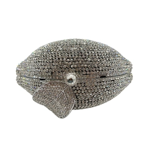 Close-up of lemon crystal clutch featuring silver rhinestones and leaf clasp detail