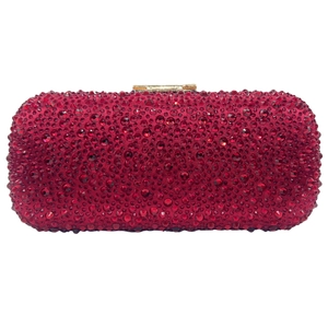 Detailed macro view of luxury red rhinestone clutch with secure gold metal clasp