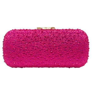 Detail of rose pink evening clutch bag with sparkling rhinestones and gold clasp