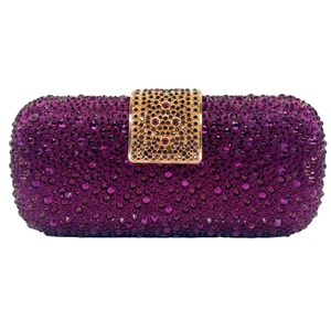 Detail of purple rhinestone clutch with gold镂空 clasp and red gemstone accent
