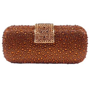 Detailed close-up of luxury rectangular evening clutch with amber sparkling crystals