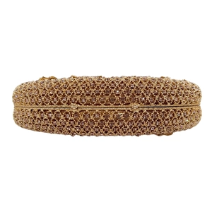 Top view detail of luxurious champagne crystal evening bag with intricate woven rhinestone mesh