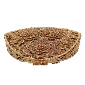 Detail of champagne gold crystal evening clutch with 3D rose flower rhinestone patterns