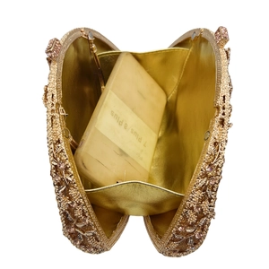 Detail view of crystal evening bag interior showing capacity for large smartphones