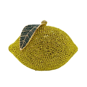 Luxury lemon-shaped evening clutch bag encrusted with bright yellow and green crystals