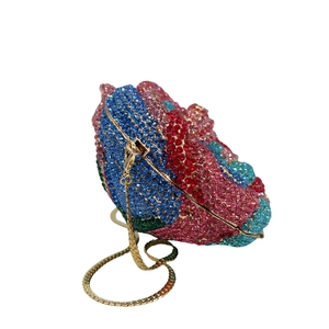 Detailed shot of multicolor crystal rhinestone evening bag with elegant gold metal frame