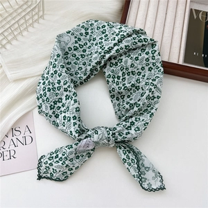 White square scarf with green floral vine pattern and elegant wavy scalloped edges