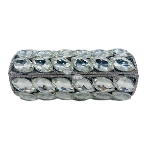 Detailed macro view of the silver cylindrical evening bag with large oval crystals