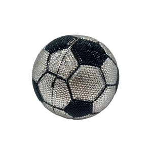 Macro shot of football-shaped evening bag with black and silver crystal rhinestones