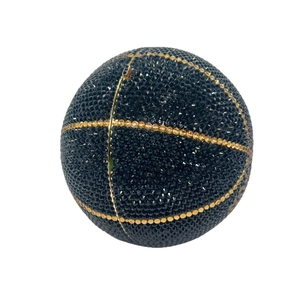 Luxury basketball-shaped evening clutch bag with black and gold crystals on white background