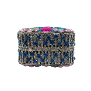 Macro detail of heavy-work hollow clutch bag with luxury colorful crystals and rhinestones