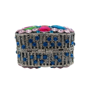 Macro detail of luxury evening clutch bag with colorful crystals and rhinestones