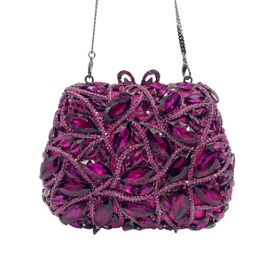 Detailed view of the purple crystal-embellished surface on the luxury evening clutch bag