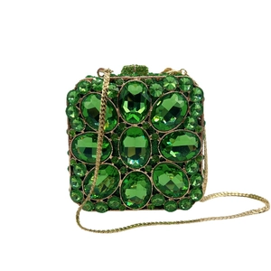 Emerald green crystal evening clutch bag with gold metal frame and detachable chain strap
