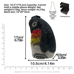 Detailed view of penguin clutch bag dimensions with crystal inlay, chain, and gift box